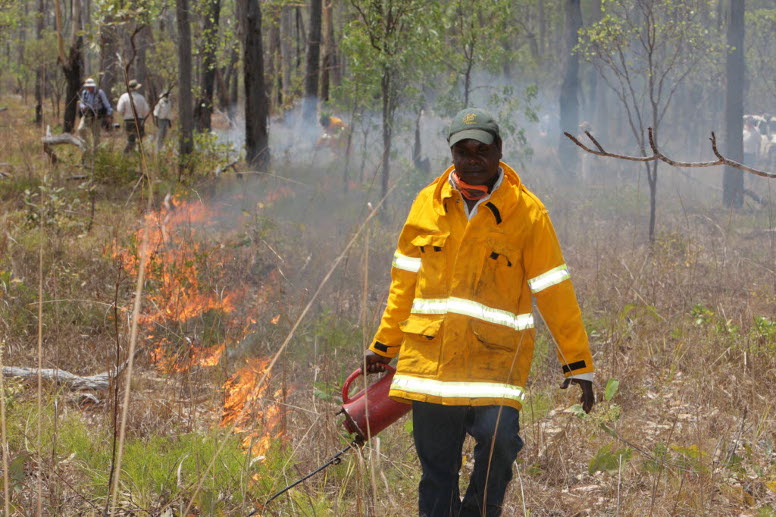 Indigenous Ranger Marcus Cameron applies a controlled burn in Warddeken Indigenous Protected Area.