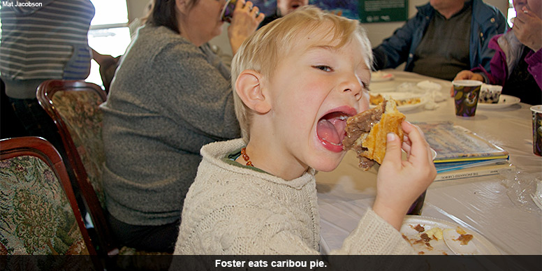 Foster eats caribou pie.