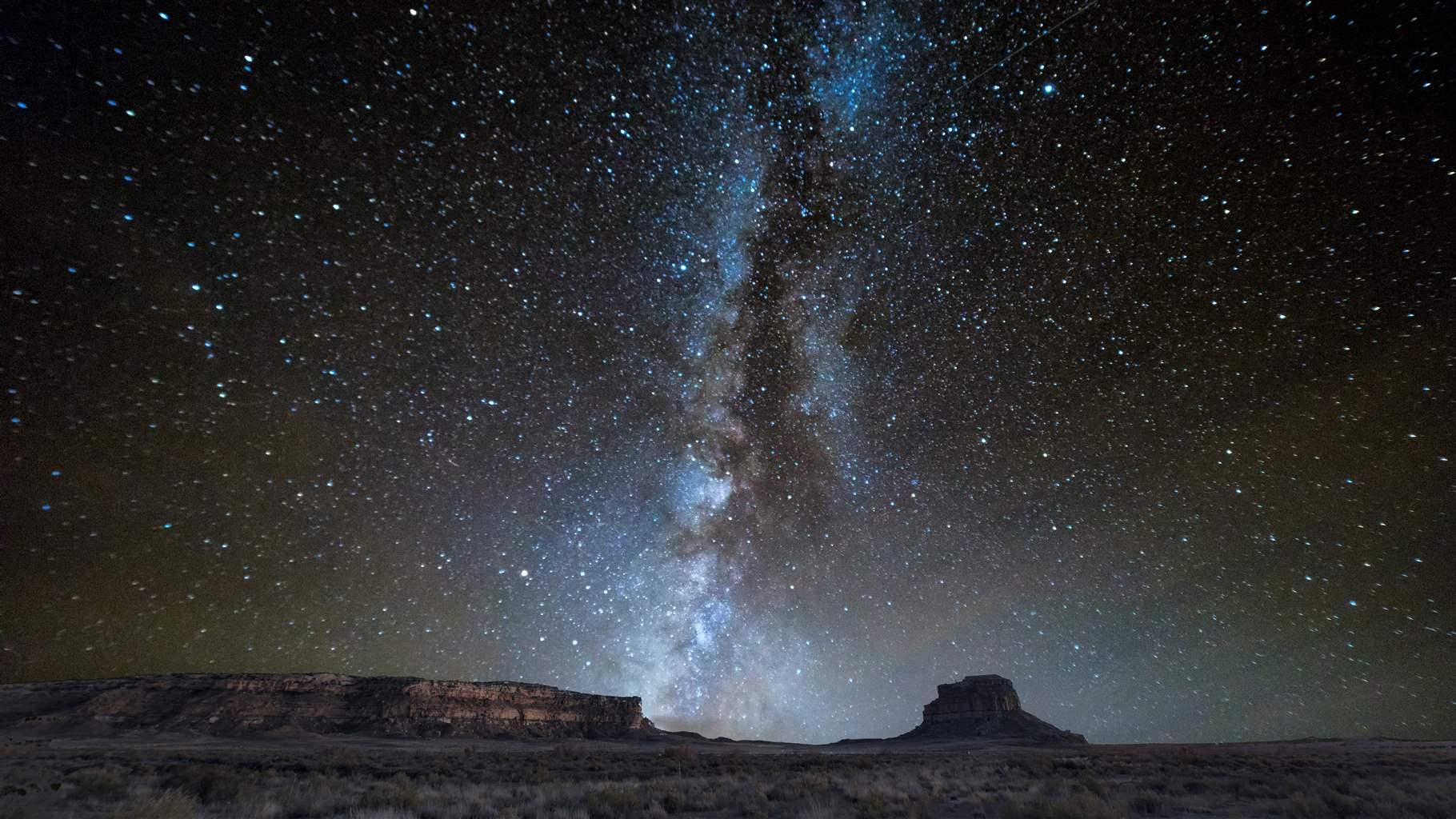 The Milky Way galaxy can be seen above a Western U.S. desert landscape at night