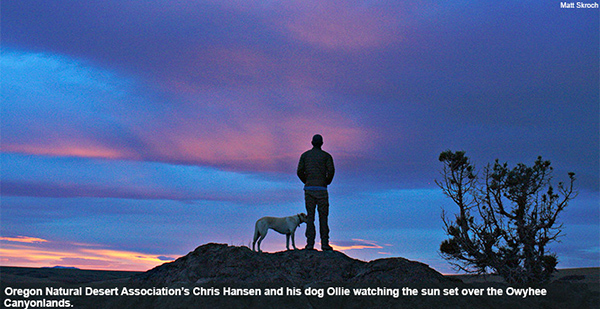 Oregon Natural Desert Association’s Chris Hansen and his dog Ollie watching the sun set over the Owyhee Canyonlands.