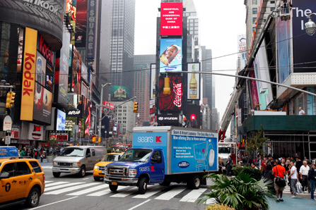 A delivery truck makes its way through New York's Times Square in October 2012.