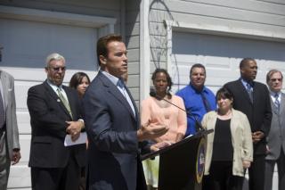 California Gov. Arnold Schwarzenegger (R) announcing a state program designed to help first-time homebuyers buy homes in neighborhoods hit hardest hit by the foreclosure crisis. California is one of several states establishing programs and enacting reforms to stave off foreclosures.