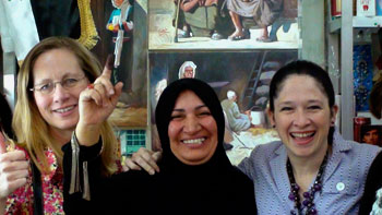 North Dakota state Rep. Bette Grande (left) and Illinois state Rep. Susana Mendoza (right) were with a group of state lawmakers who helped monitor Iraq's elections earlier this month. Here, they pose with an Iraqi woman whose finger is purple, indicating she had voted.