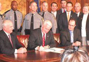 Governor Tom Corbett signing bill