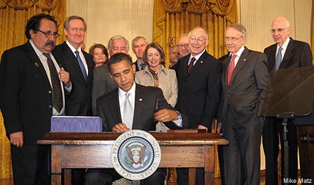 President Obama signing the Omnibus Public Land Management Act