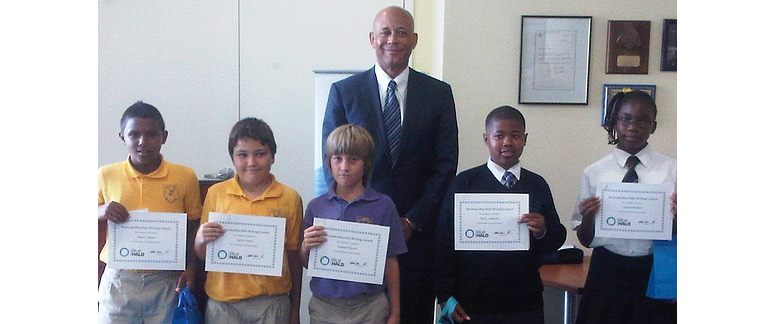 The winners with the Hon. Sylvan Richards J.P., M.P. (from left) Amori Simons, Carlos Sousa, Samuel Bleeker, Nasir Simmons, and Gabrielle Reid​- Photo D. Reid.​ Second place poetry winner Hannah Horsfield was unable to attend.​