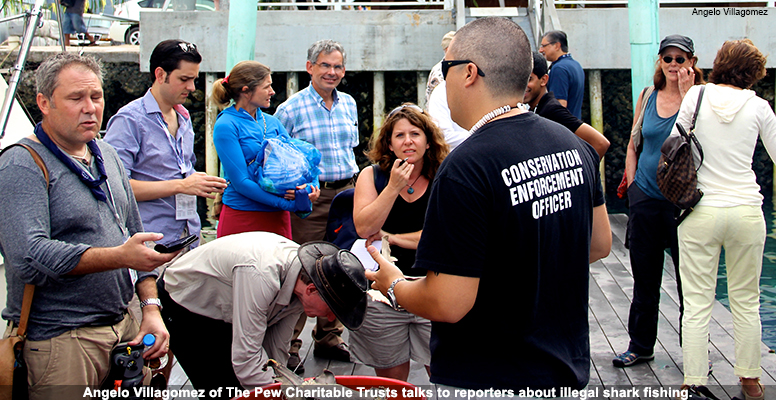 Angelo Villagomez of The Pew Charitable Trusts talks to reporters about illegal shark fishing.