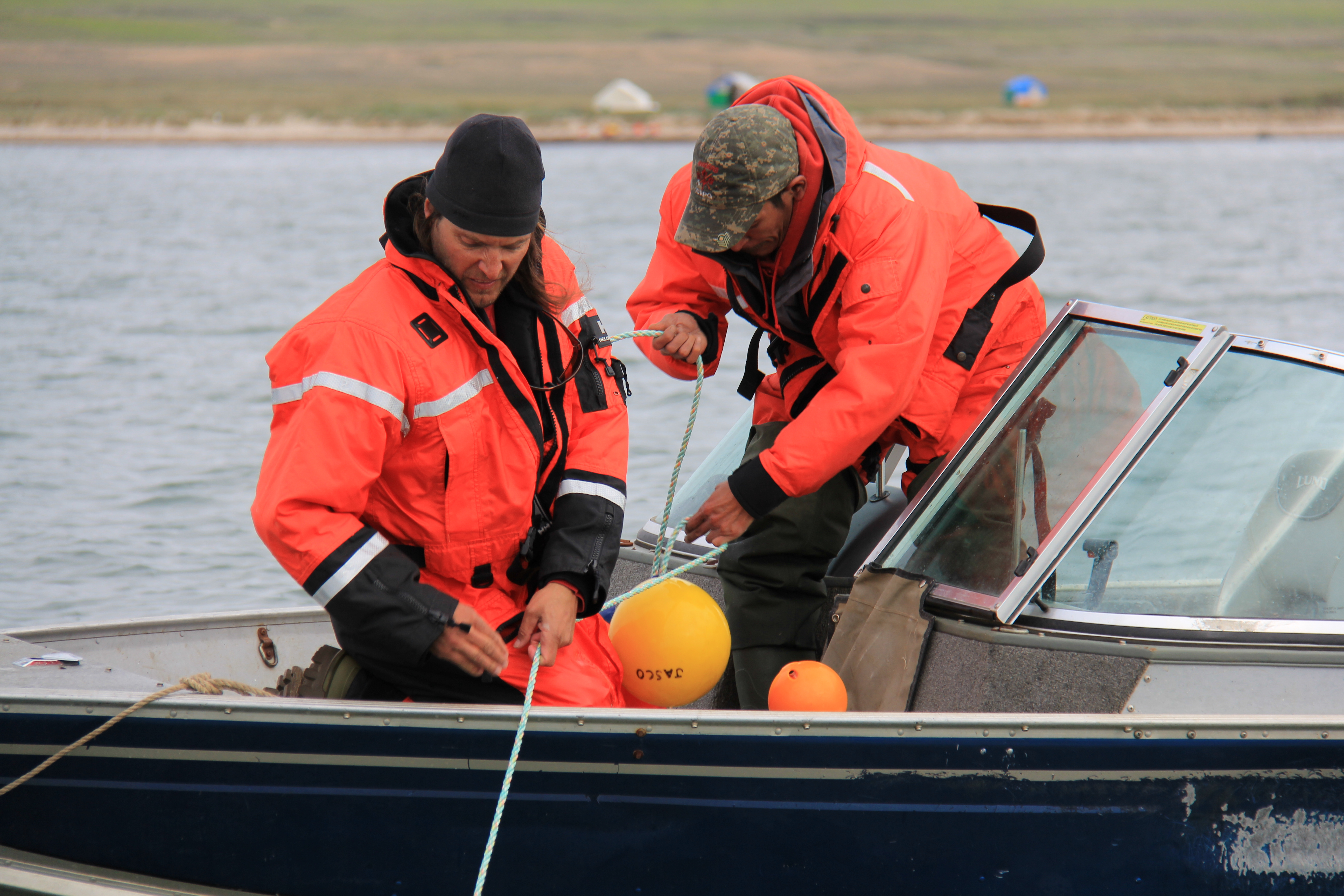 Technicians deploy a hydrophone in Darnley Bay.