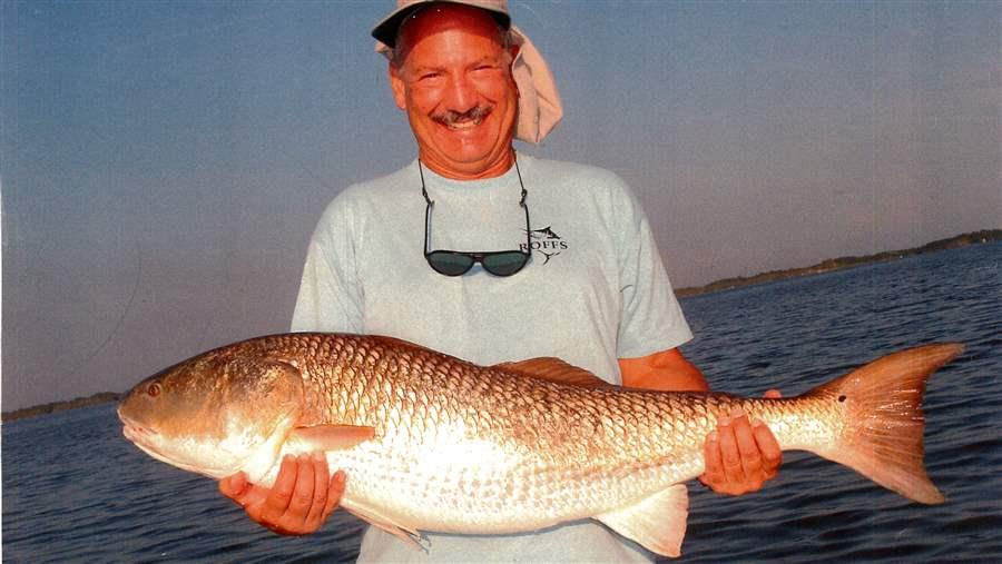 Mitch Roffer with a jumbo red drum, also known as a bull redfish, caught in the Indian River Lagoon (IRL) in east Central Florida. The IRL complex—which includes the Banana River Lagoon, several rivers and the Mosquito Lagoon—is a popular red drum fishing destination. Adult red drum rely on forage fish for the energy and nutrients necessary to grow and reproduce.