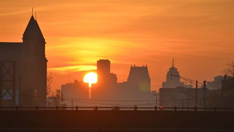 Sun setting behind Detroit