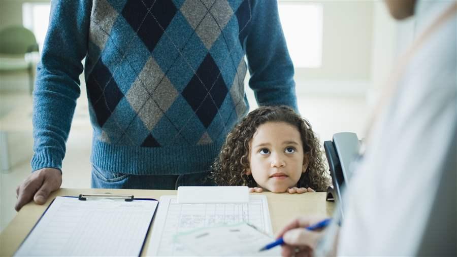 Little girl waiting with father