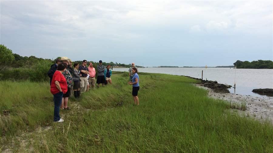 Tracy Skrabal at Morris Landing explains difficulties of acquiring living shoreline permits