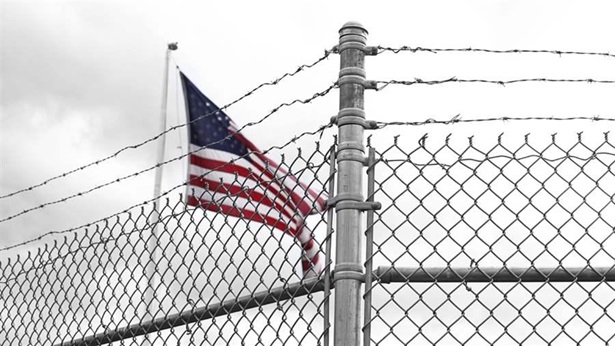 Flag behind a fence