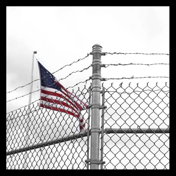 Flag behind a fence