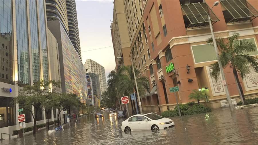 Flooded street with vehicle