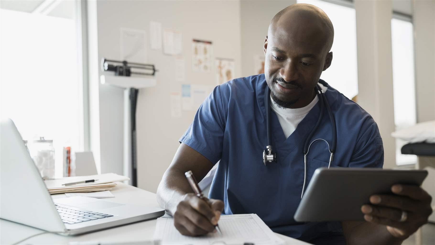 Doctor with tablet