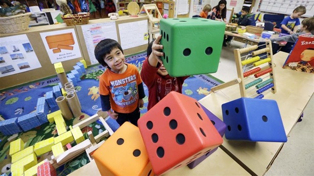Preschoolers at the Creative Kids Learning Center in Seattle. A growing number of cities and states are imposing academic standards and other rules on child care providers and using public money to expand access to them.