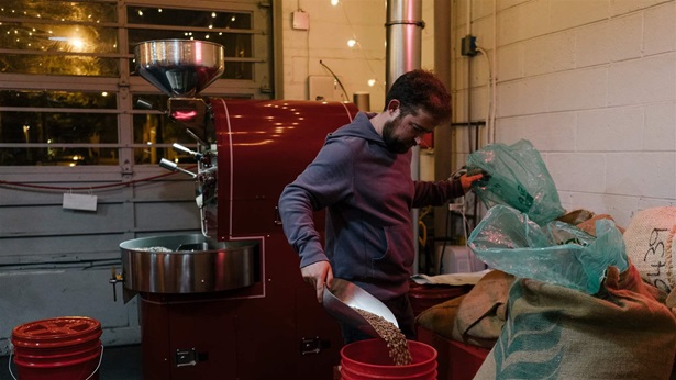 Mathew Falco, owner of Herman's Coffee prepares beans for the day at his business in the Pennsport neighborhood of Philadelphia, Pa., on Nov. 8, 2019.