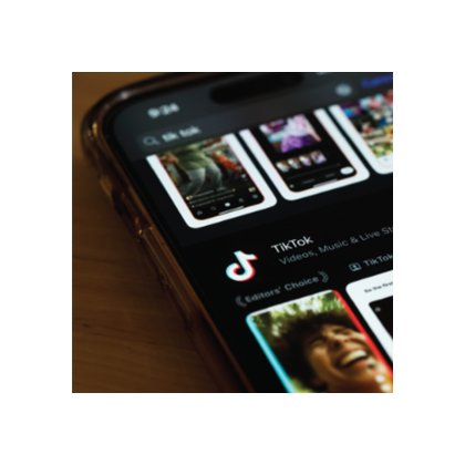 A close-up photo of a phone that has the TikTok app selected in an app store.