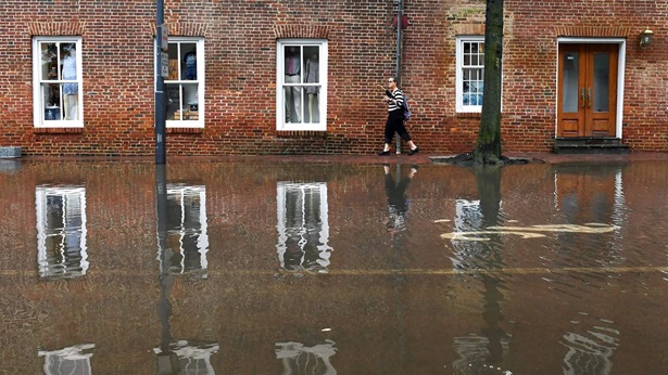Woman walking in floodwater
