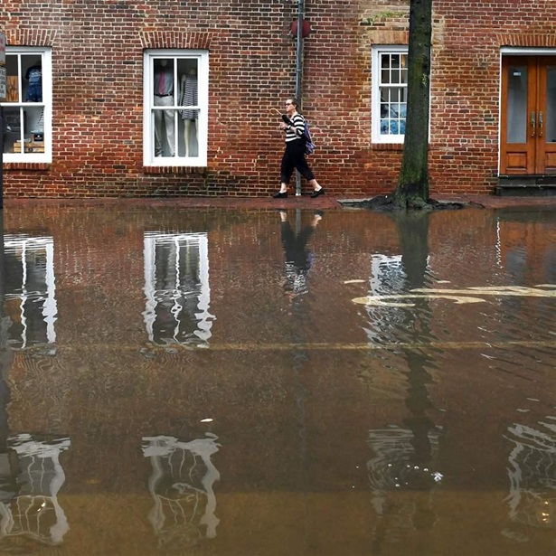 Woman walking in floodwater