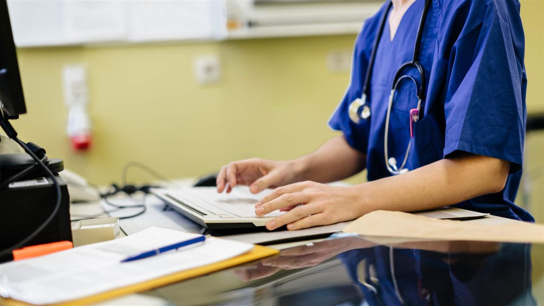 Health professional at desk