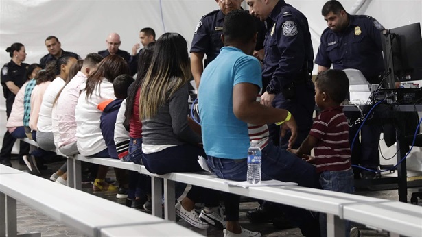 Migrants wait to apply for asylum Migrants wait to apply for asylum