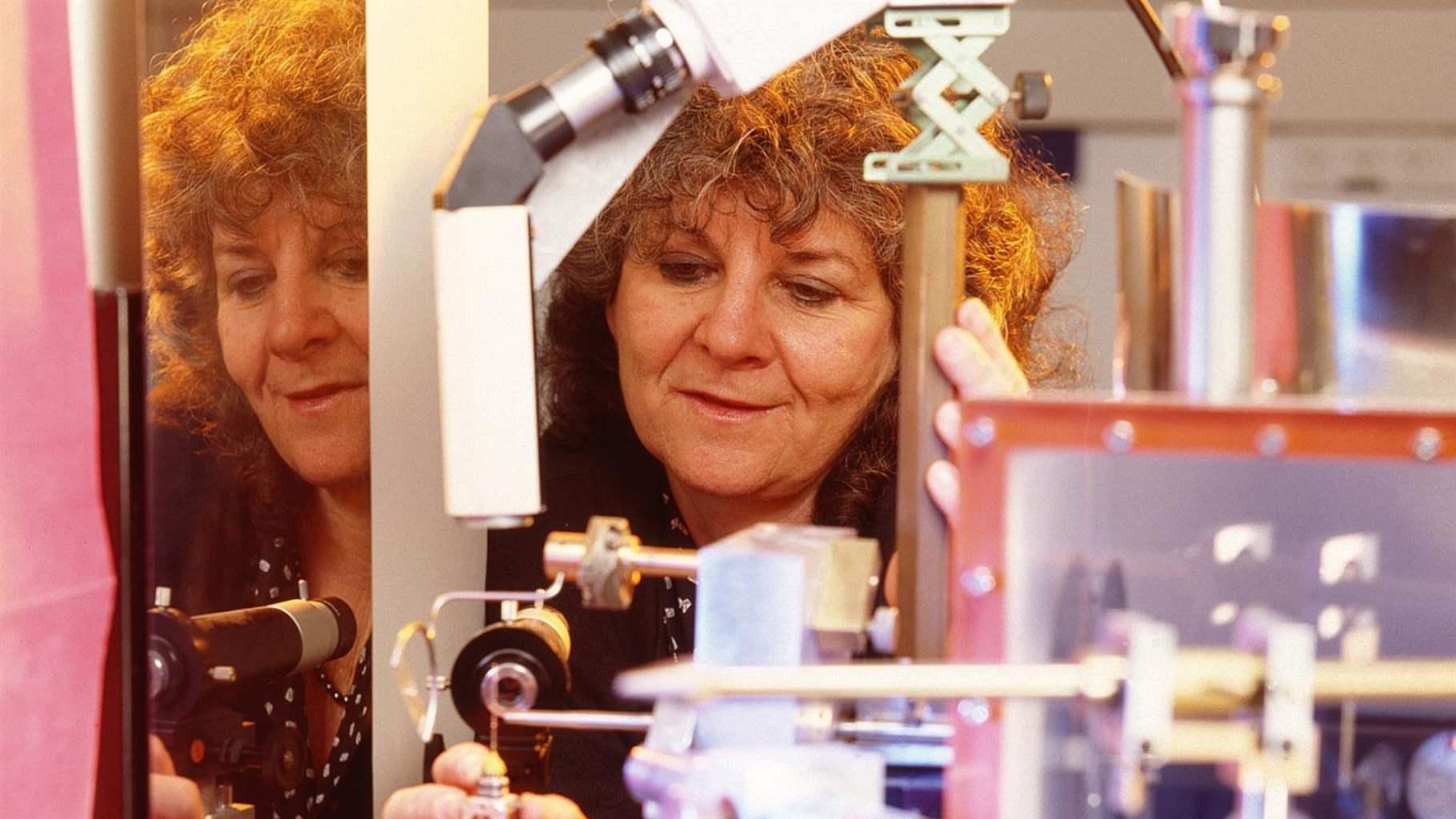 Professor Ada Yonath of Weizmann Institute of Science looking through a microscope