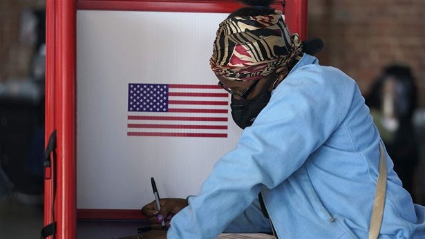 Person casting ballot