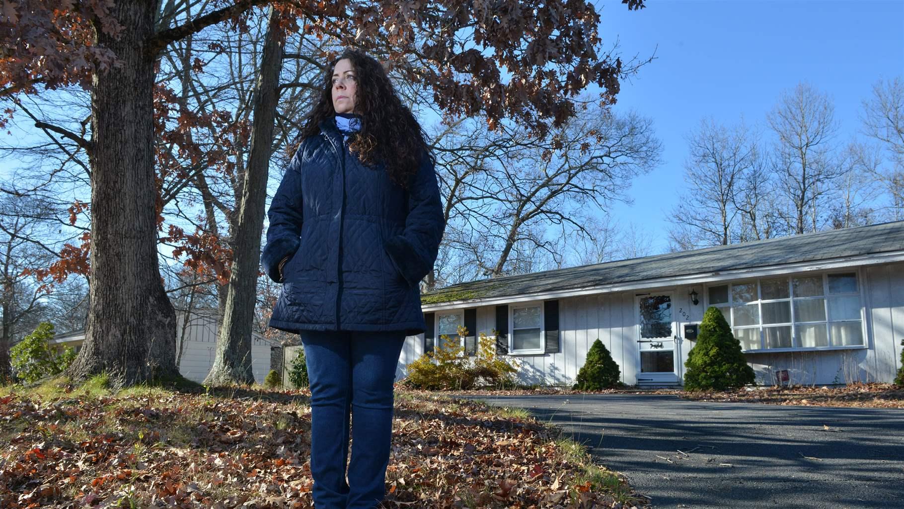 Women standing behind home 