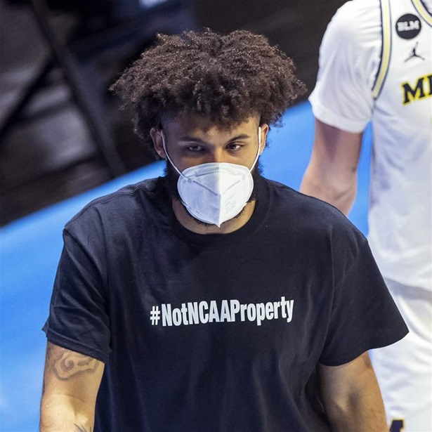 Isaiah Livers wears a T-shirt that reads "#NotNCAAProperty"