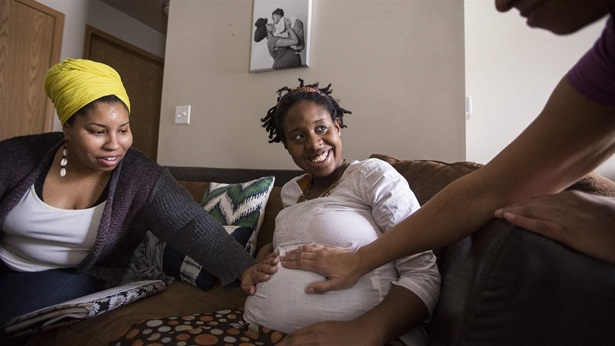 pregnant woman with two doulas pregnant woman with two doulas