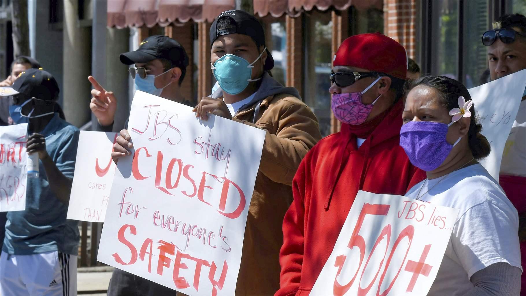 JBS workers protest Tuesday, June 9, 2020, in Logan, Utah. Hundreds of workers at the meatpacking plant in Hyrum, Utah have tested positive for COVID-19.