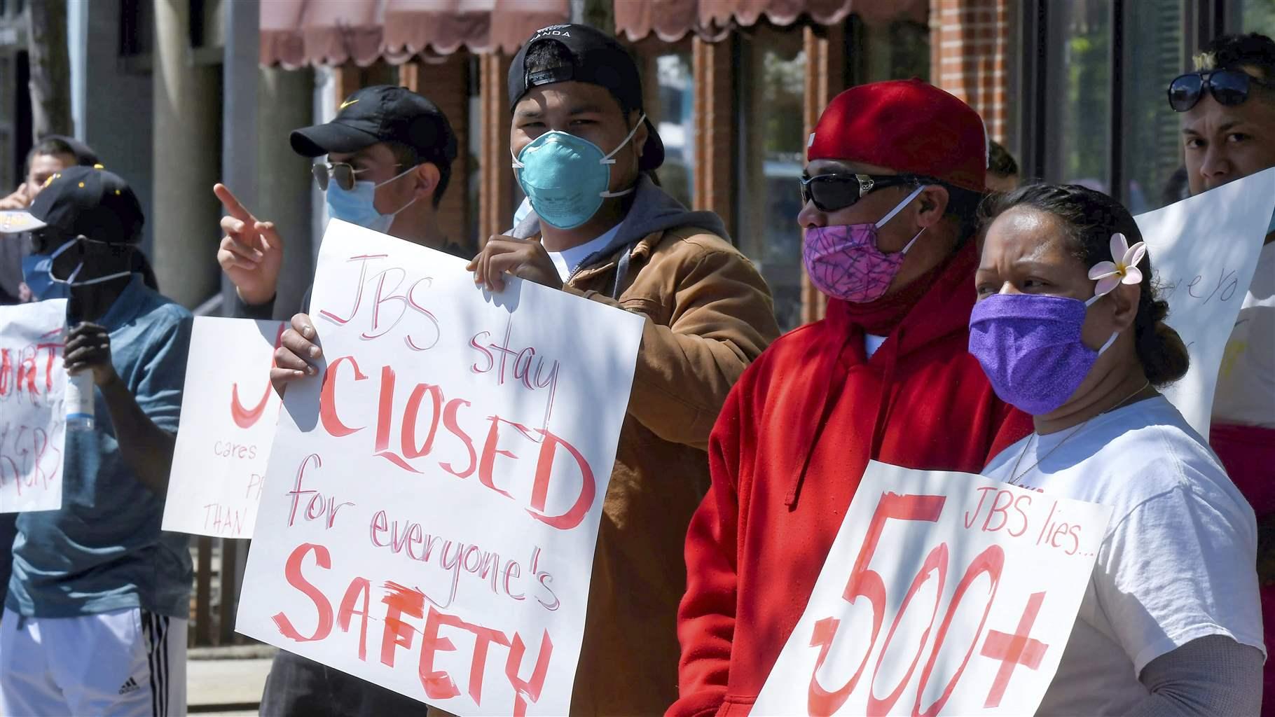 VIRUS OUTBREAK UTAH JBS workers protest Tuesday, June 9, 2020, in Logan, Utah. Hundreds of workers at the meatpacking plant in Hyrum, Utah have tested positive for COVID-19.