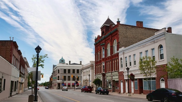 Main street of small town, with historical architecture and store-front buildings.