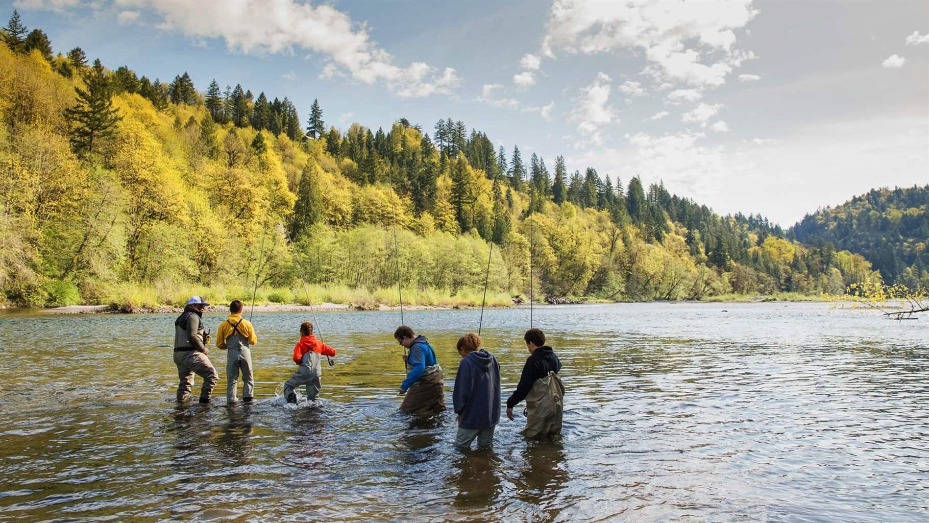  Chad Brown, far left, leads urban youth from Portland, Oregon, on a day of fishing.