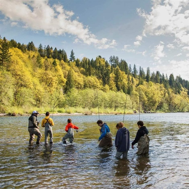  Chad Brown, far left, leads urban youth from Portland, Oregon, on a day of fishing.
