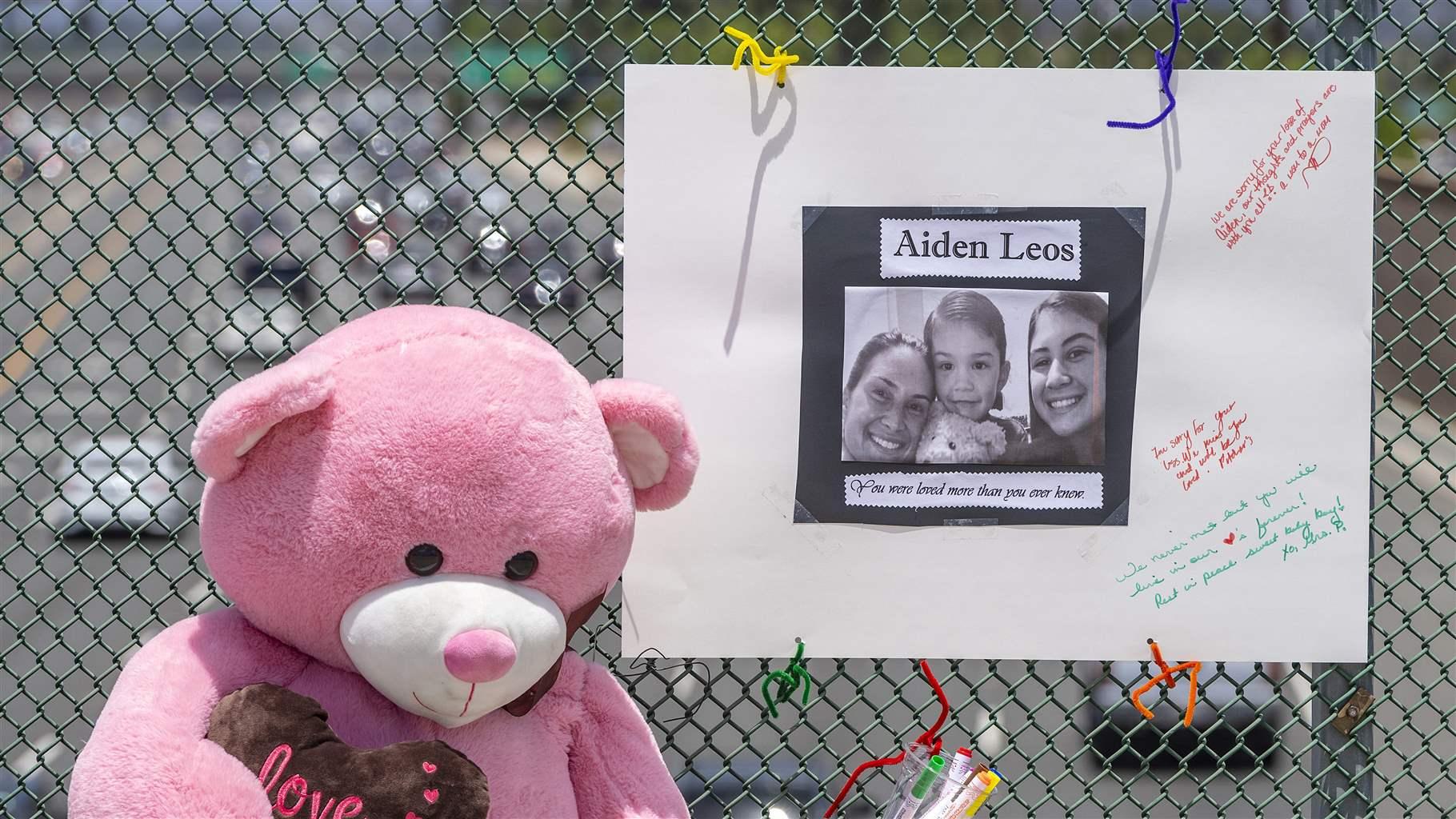 A stuffed bear and a poster memorialize a 6-year-old Orange County, California, boy who was shot and killed during a road rage attack in May. 