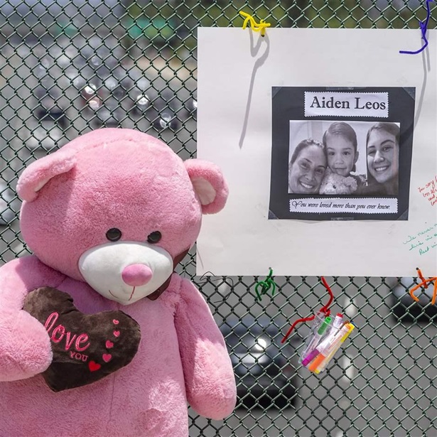 A stuffed bear and a poster memorialize a 6-year-old Orange County, California, boy who was shot and killed during a road rage attack in May. 