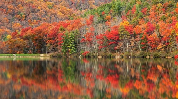 Autumn colors reflect off Sherando Lake in the George Washington National Forest 