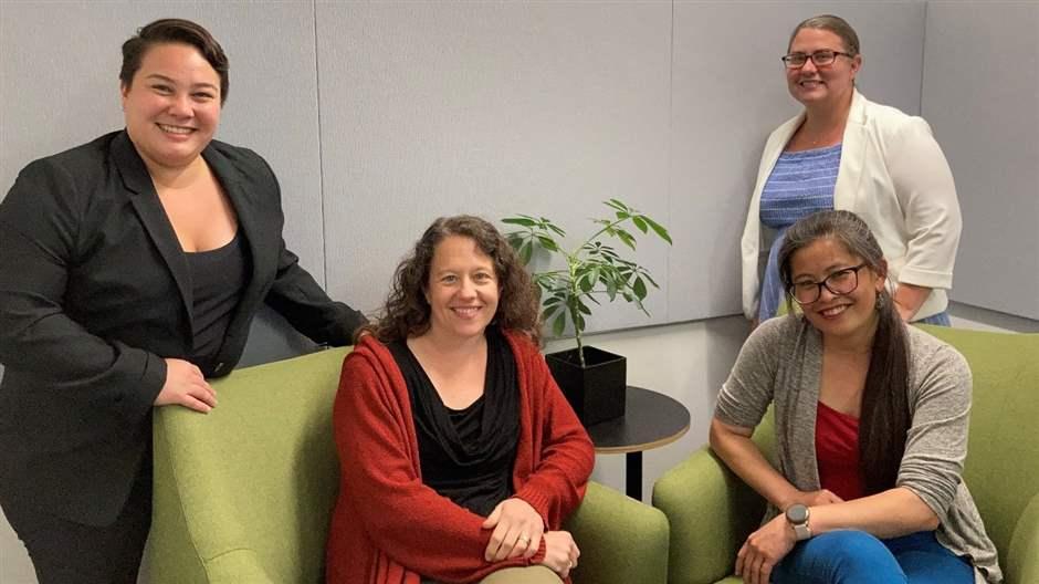 Staffers at the Massachusetts Department of Public Health pose at their office