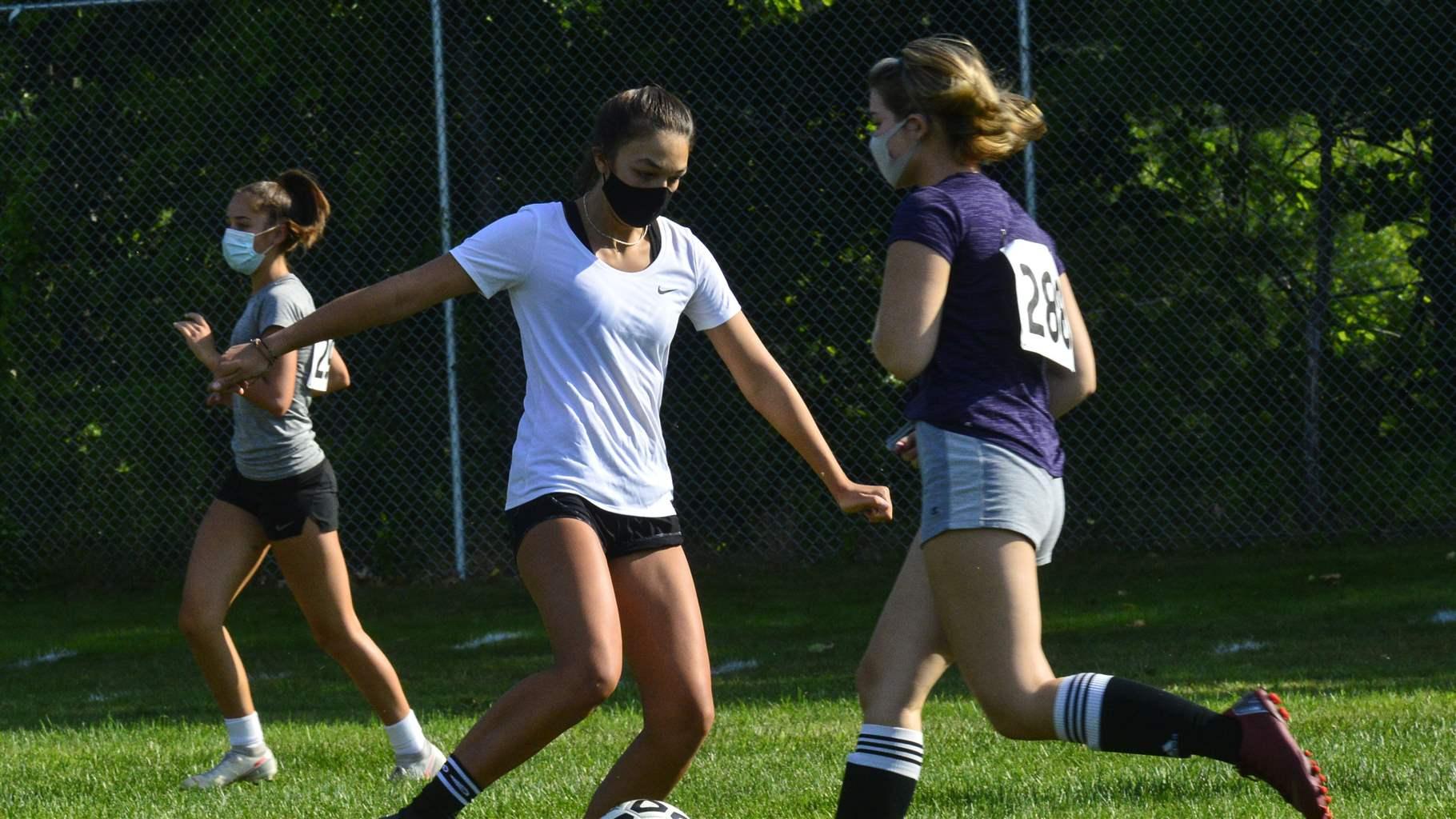 Members of the Brattleboro, Vt., Union High School's girls' varsity soccer team practice for the first time for the season on Tuesday, Sept. 8, 2020, as high school sports returns for the first time since the COVID-19 pandemic canceled the Spring season. 