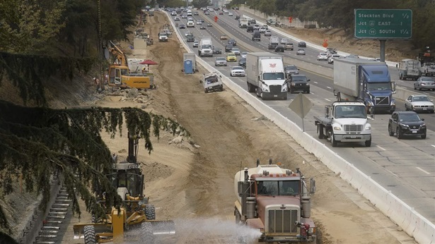 Traffic flows past construction work on eastbound Highway 50 in Sacramento, Calif., Thursday, Aug. 12, 2021. 