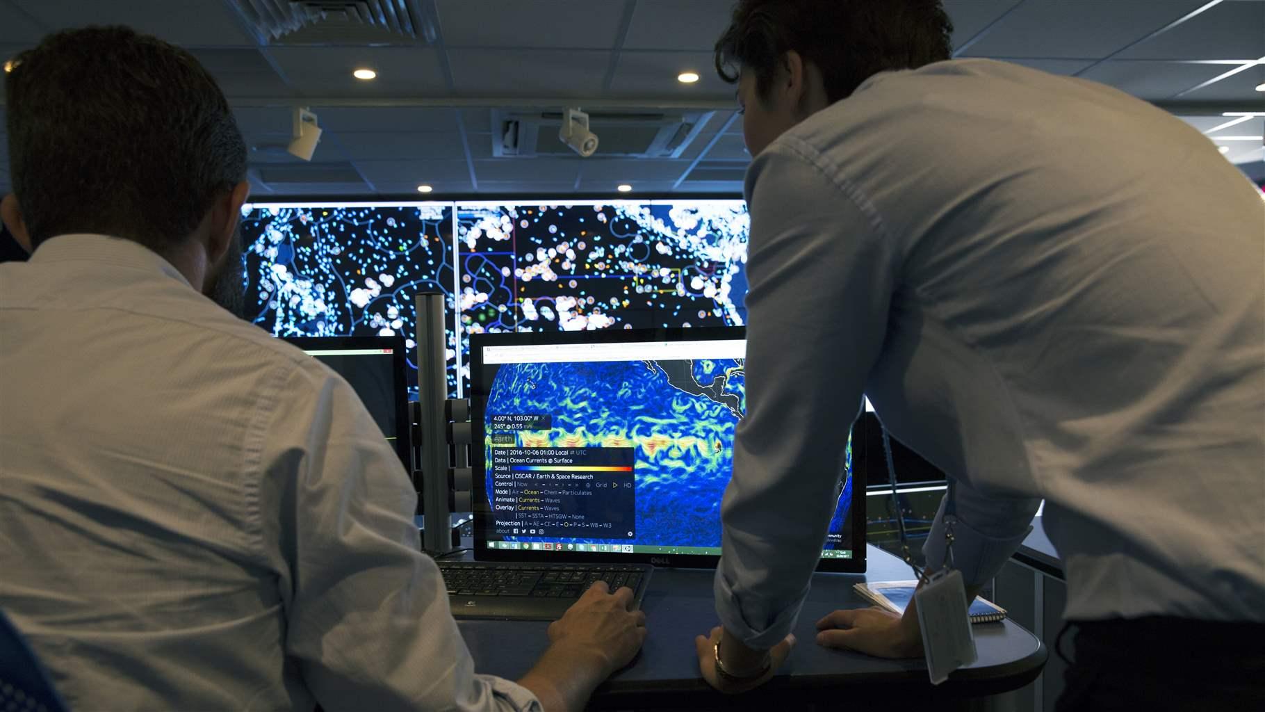 Analysts inside the Satellite Applications Catapult Operations Centre in Harwell, England where analysts from Ocean Mind work with Overseas Ocean Monitor technology to monitor fishing activities around the world.