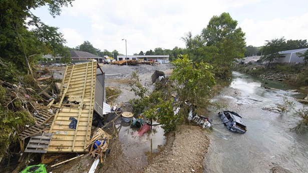 A trailer and car were swept up by flash flooding recently, shown Monday, Aug. 23, 2021, in Waverly, Tenn.