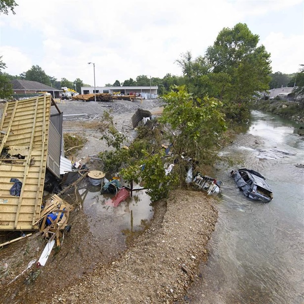 A trailer and car were swept up by flash flooding recently, shown Monday, Aug. 23, 2021, in Waverly, Tenn.