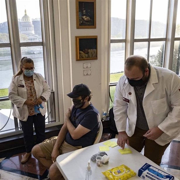 Health Professionals prepare to vaccinate a student in Riggleman Hall. The Kanawha-Charleston Health Department led a vaccination effort on the campus of the University of Charleston. 1,800 doses of the Johnson & Johnson Janssen Covid-19 vaccine were on hand to be given out to all persons aged 16 years and older.