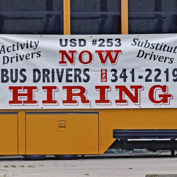 Bus driver hiring sign on bus