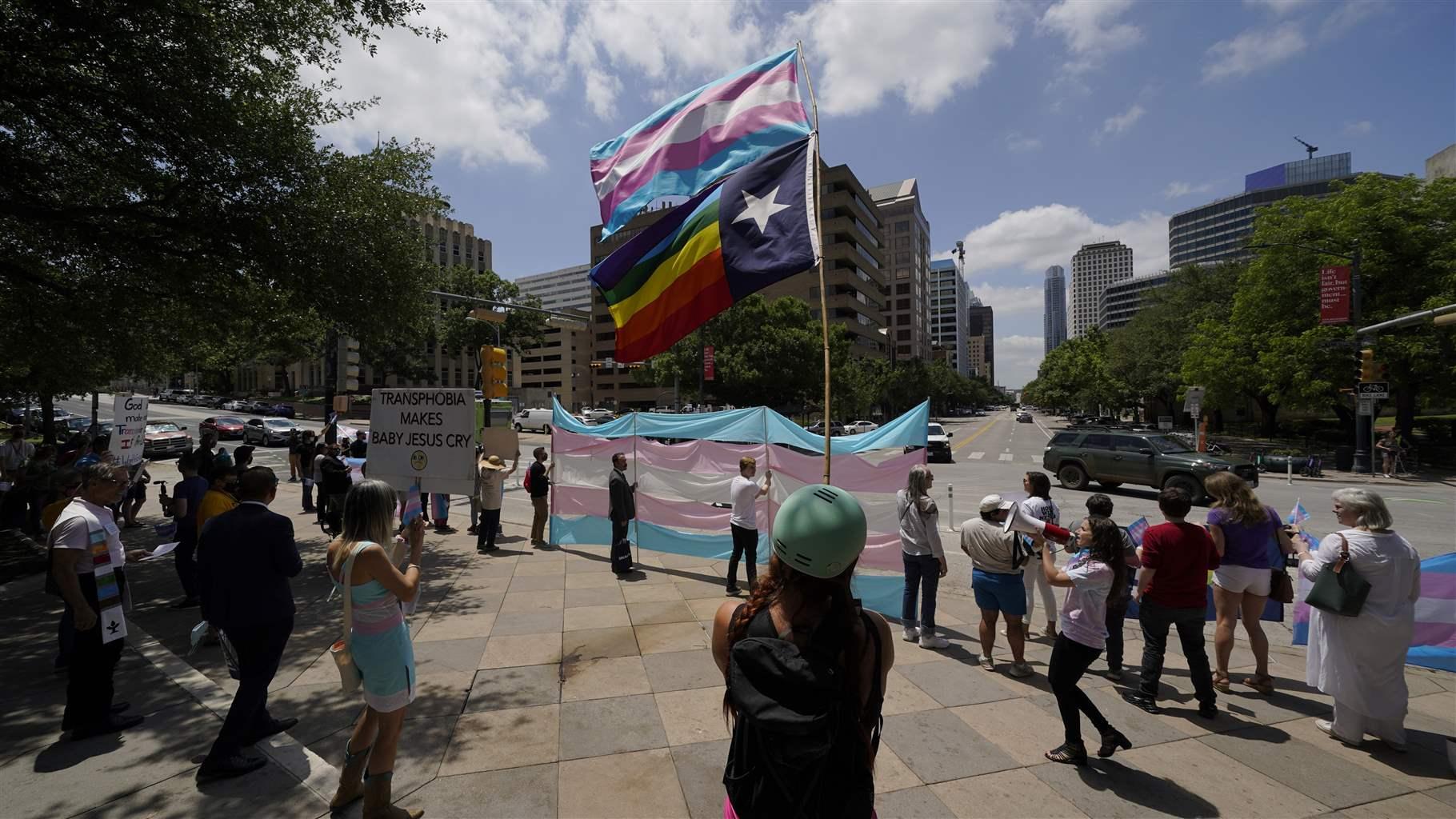 Demonstrators gather on the steps to the State Capitol to speak against transgender related legislation bills being considered in the Texas Senate and Texas House, Thursday, May 20, 2021, in Austin, Texas.