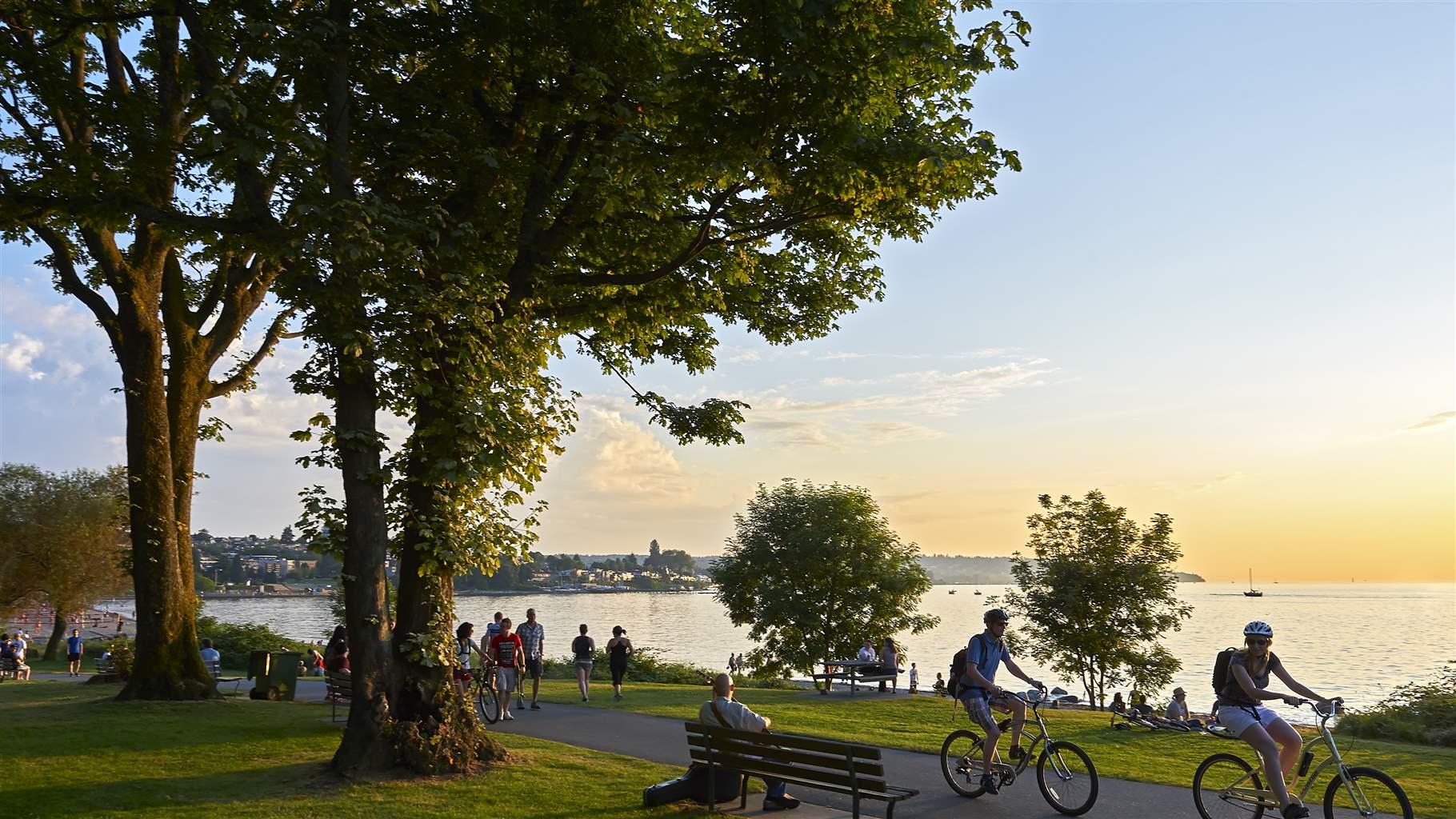 Young people biking and walking at Stanley Park